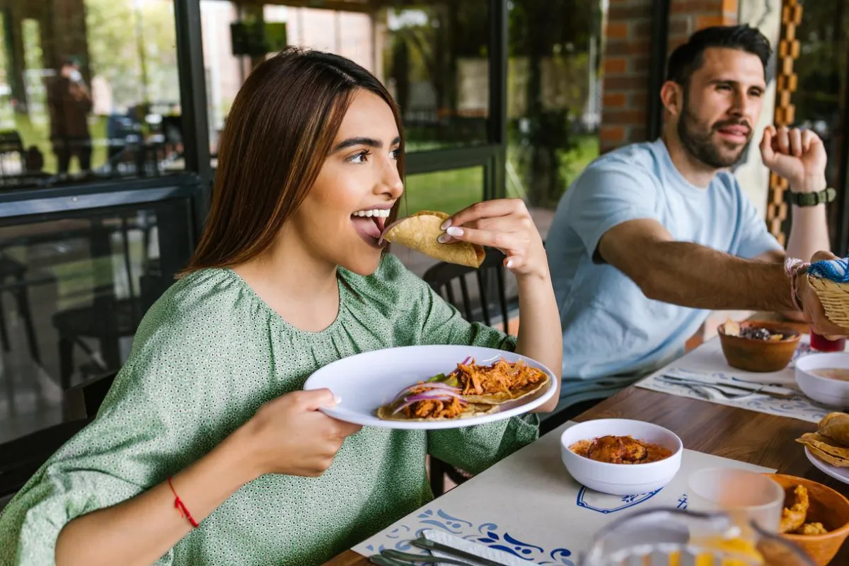 Couple enjoying a meal after an ATV adventure